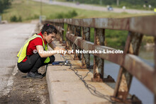 Mitra Nasimi connects a replacement cable for the bridge sensors before testing began on the Platte 