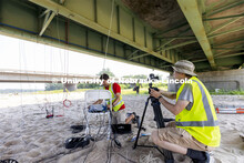 Ricky Woods, Associate Professor of Civil and Environmental Engineering, checks the cable connection