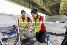 Ricky Woods, Associate Professor of Civil and Environmental Engineering, and Mitra Nasimi replace a 