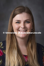 Studio portrait of Brooke Adam, Human Resources Coordinator for the College of Arts and Sciences Pou