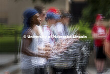 The sticks are flying as Tamario Brooks and the Cornhusker Marching Band snare line practices Thursd