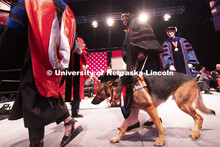 Sheila wears a tam and hood like her owner, Nicole Green. The service dog accompanied Nicole Green a