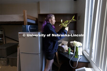 Robin Lindemann, a First Husker from Arlington, TX, checks to see how her plants survived the drive 