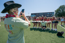 Students take photos with friends and event organizers. Sorority bid day recruitment. August 21, 202