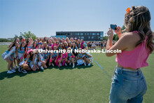 A sorority takes a group photo on the Vine Street fields. Sorority bid day recruitment. August 21, 2