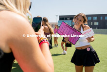 Students pose for photos during Sorority Rush Bid on the Vine Street fields. Sorority bid day recrui