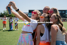 Students pose for photos during Sorority Rush Bid on the Vine Street fields. Sorority bid day recrui