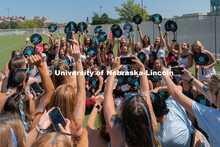 Students pose for photos during Sorority Rush Bid on the Vine Street fields. Sorority bid day recrui