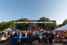 Students walk around East Memorial Stadium Loop during the Big Red Welcome Street Festival. The Stre