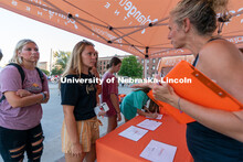 Students talk to local clubs and businesses during the Big Red Welcome Street Festival. The Street F