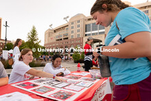 A student talks to club representatives during the Big Red Welcome Street Festival. The Street Festi