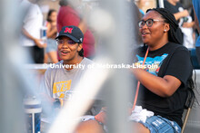 Students smile as they play Mario Kart against each other during the Big Red Welcome Street Festival