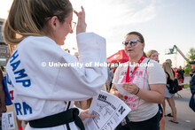 A student talks to a club representative during the Big Red Welcome Street Festival. The Street Fest