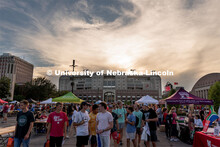 Students walk around East Memorial Stadium Loop during the Big Red Welcome Street Festival. The Stre