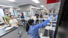 Students listen to instructions during their first day in the newly renovated organic chemistry labs