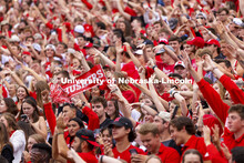 The student section hold up a Husker sign as they cheer on the team. Nebraska vs. Fordham University