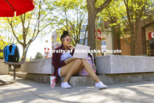 Briana Barrios, a first-year student from Schuyler, Nebraska, studies outside the Nebraska Union on 
