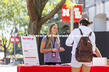 Mariah Petersen, a CAPS outreach coordinator talks with a student at the counseling and psychologica