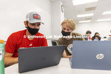 Students talk over their scenarios in the Human - Computer Contact robotics course taught by Brittan