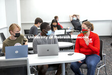 Students talk over their scenarios in the Human - Computer Contact robotics course taught by Brittan