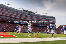 Nebraska players celebrate a touchdown. Nebraska vs. Buffalo University game on the 20th anniversary