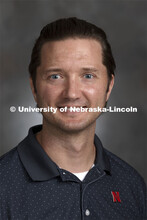 Studio portrait of Jason Pawlenty, IANR assistant extension educator at Eastern Nebraska Research an