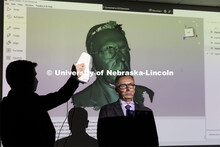 Chancellor Ronnie Green sits for a demonstration of the 3D Scanner. Nebraska Innovation Studio grand