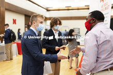 Sean Tarpey, a junior in marketing, talks with recruiters at Tuesday’s Career Fair.  Day 1’s car
