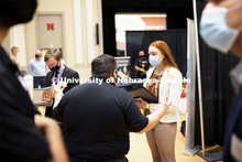 Meghan Schuette, a senior in international business and marketing, talks with Jonathan Fast, an Unio