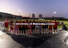 Triad 5 – Kappa Kappa Gamma, Phi Kappa Theta and Phi Mu practices on stage as the crowd filled par