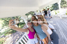 The Alpha Phi team takes a selfie on East Campus’ Perin Porch to show they solved their clue as an