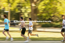 A team races from Perin Porch to the Dairy Store as part of the Homecoming Traditions Race. The Trad