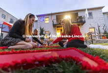 Mary Foster and Morgan (no last name given) of the Chi Omega sorority decorate outside the Theta Xi 