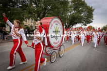 The restored Cornhusker Marching Band base drum leads the band down R Street Friday night.  The five