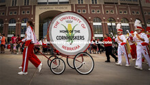 The restored Cornhusker Marching Band base drum leads the band down R Street Friday night.  The five