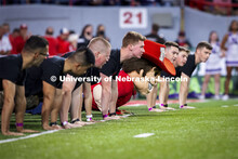 Herbie Husker participates with the ROTC Cadets in push-ups for points. Nebraska vs Northwestern Uni