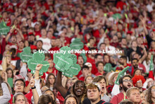 The student section wave foam shamrocks to help promote the 2022 Nebraska vs Northwestern University