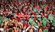 The student section wave foam shamrocks to help promote the 2022 Nebraska vs Northwestern University
