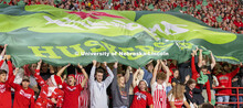 The student section holds a large shamrock Husker flag to help promote the 2022 Nebraska vs Northwes
