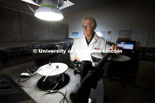 Senior Nebraska Mesonet technician Glen Roebke runs tests on a set of solar radiation sensors for we