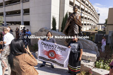 Members of the Omaha Tribe pose for photos with the sculpture of Dr. Susan LaFlesche Picotte, the fi