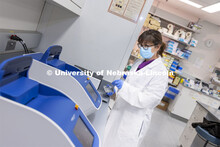 Lab manager Sandra Thibivilliers works with a sample for the 10X Genomics chromium controller. The C