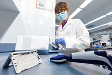 Lab manager Sandra Thibivilliers works with a sample for the 10X Genomics chromium controller. The C