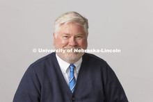 Studio portrait of Doug Bush, Assistant Director of Bands, Glenn Korff School of Music, Hixson-Lied 