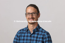 Studio portrait of Drew Davis, Digital Instructional Specialist, School of Art, Art History and Desi