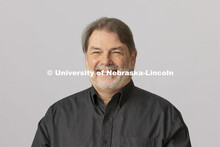 Studio portrait of Tony Falcone, Associate Director of Bands, Glenn Korff School of Music. Hixson-Li