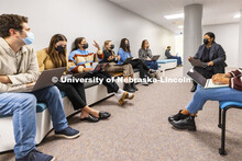 Jemalyn Griffin (right, in gray) works with students in the Jacht Ad Lab Monday in the College of Jo