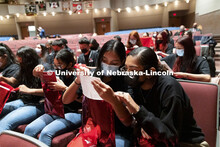 Omaha South seniors Marian Rodriguez and Lizbeth Valente Alday look over the admission certificates.