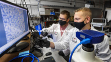 Eric Markvicka, Assistant Professor in Mechanical and Materials Engineering, center, and Ethan Kring