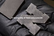 Ethan Krings, graduate student in mechanical engineering from Humphrey, Nebraska, holds a rubber-lik